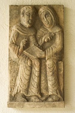 listening monks, stone carving